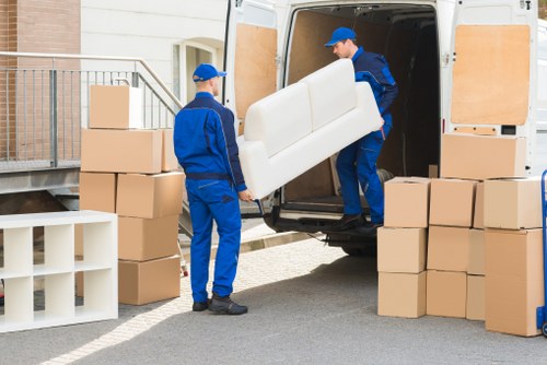Man and van removal team loading furniture in Erith