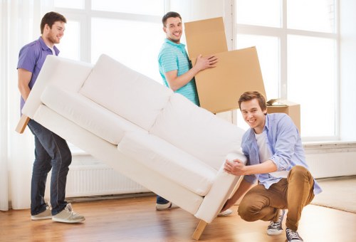 Loading furniture and boxes into a moving truck for an Erith move