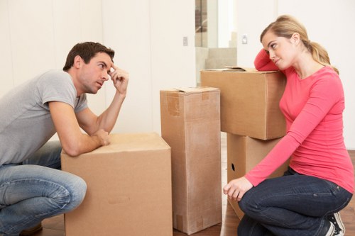 Local team collecting sofas and chairs from an Erith property