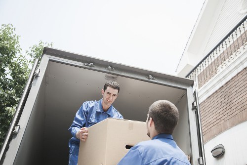 Professional movers navigating a residential street in Erith