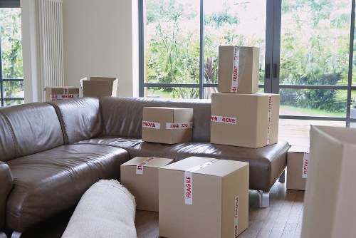 Local removals team handling furniture in an Erith property
