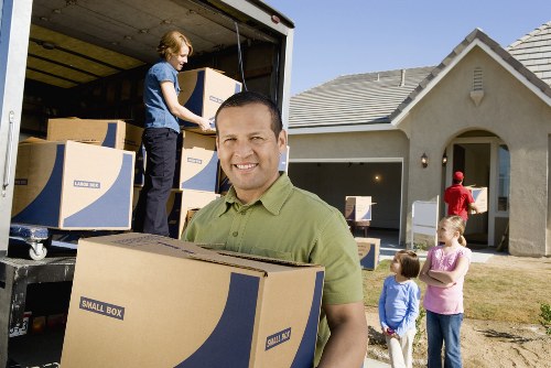 Local packing team preparing a move in an Erith residential street