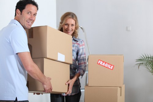 Unpacking boxes in a new Erith property to help a customer settle in faster