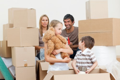 Low-waste removals team separating furniture and cardboard for recycling