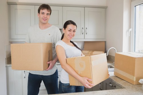 Professional movers handling furniture in Erith